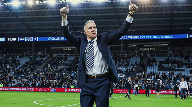 Picture of Peter Vermes on the Children's Mercy Park pitch giving two thumb s up to the Cauldron faithful